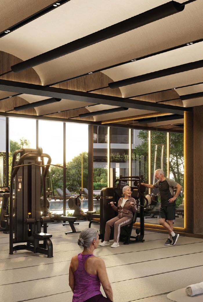 Timber-ceilinged gym opening onto the pool deck